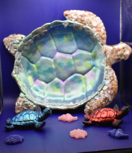 Tortoise-shaped bowl with small turtle figurines 